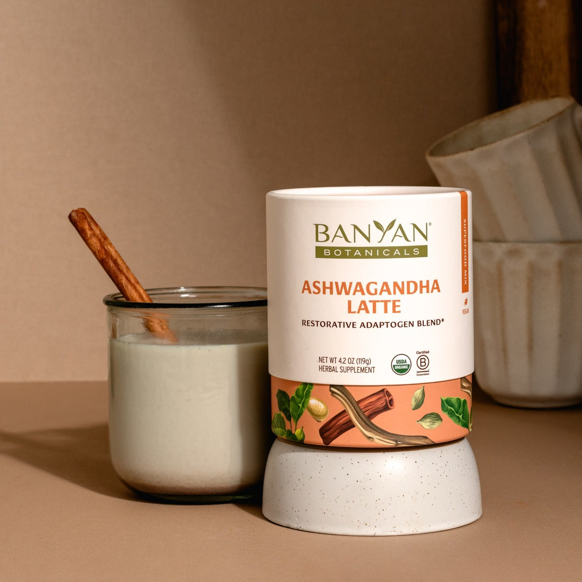 ashwagandha latte next to product packaging